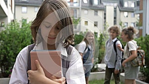 Group of schoolchildren mocks a classmate. Childhood cruelty. School bullying.