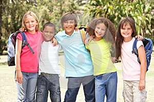 Group Of Schoolchildren Standing In Park photo