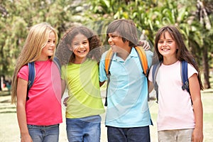 Group Of Schoolchildren Standing In Park photo