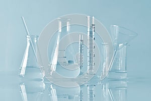 Group of scientific laboratory glassware with clear liquid solution, Research and development.