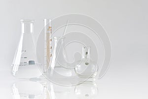 Group of scientific laboratory glassware with clear liquid solution, Research and development