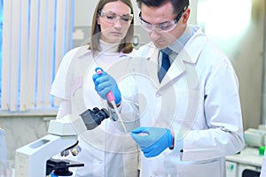 A group of scientists conducts research in a scientific laborato