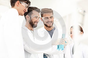 Group of scientists working with chemicals