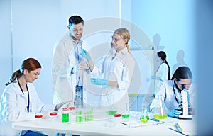 Group of scientists working in chemistry laboratory