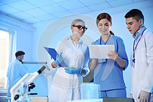 Group of scientists working in chemistry laboratory
