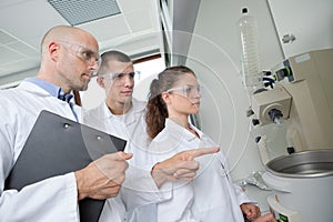 Group scientists working at laboratory