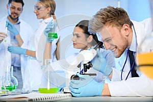 Group of scientists working in chemistry laboratory
