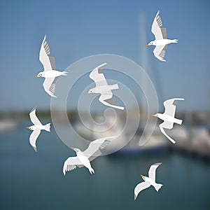 Group of seagulls flying on the sea background