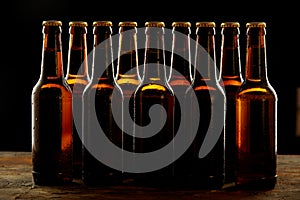 Group of sealed unlabelled brown beer bottles