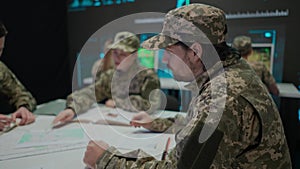 Group of security squad in control center. Military headquarters surveillance officers cyber police working in office