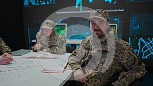 Group of security squad in control center. Military headquarters surveillance officers cyber police working in office