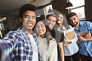 Group selfie of happy international college students