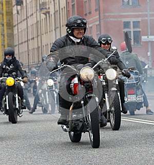 Group of senior bikers on old fashioned motorcycles