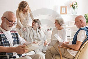 Group of senior friends spending time together at nursing home