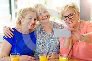 Group of senior friends taking a selfie