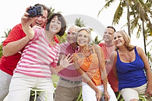 Group Of Senior Friends Taking Selfie On Bicycle Ride