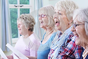 Group Of Senior Women Singing In Choir Together photo