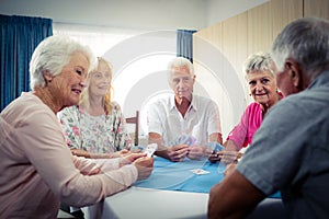 Group of seniors playing cards