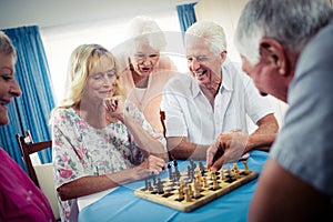 Group of seniors playing chess