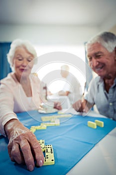 Group of seniors playing dominoes