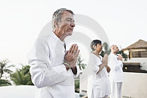 Group of seniors practicing yoga