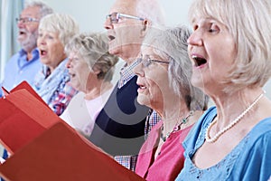 Group Of Seniors Singing In Choir Together