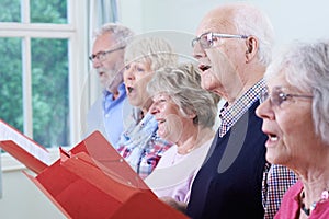 Group Of Seniors Singing In Choir Together