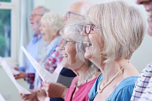 Group Of Seniors Singing In Choir Together photo