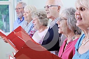 Group Of Seniors Singing In Choir Together