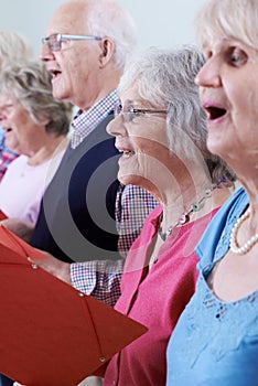 Group Of Seniors Singing In Choir Together