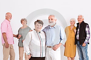 Group of seniors standing in room