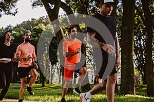 Group of serious people running in the park