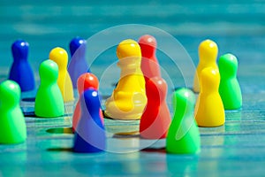 Group, set of colorful game pieces, shallow dof, closeup. Large variation of game pieces, different colors. One chess pawn
