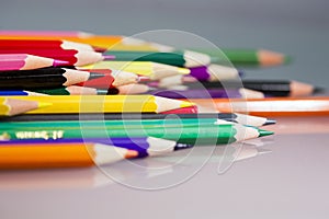 Group of sharp colored pencils with details and reflexions