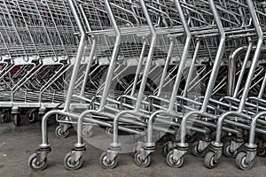 Group of shopping carts, wheels in front of supermarket