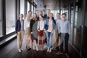 Group shot of business people in modern office hall