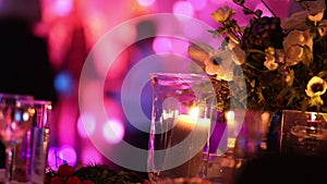 Group of silhouetted people dancing in a dark banquet hall for a wedding reception.The Wedding Banquet, people dance -