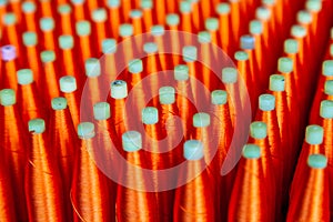 Group of Silk Spools with Red Silk Thread Yarn for Weaving Machine to make Thai Fabric Silk