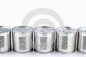 Group of silver canned food on white background