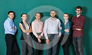 Group of six businesspeople colleague in modern company standing together. The idea for team work in a business office