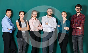 Group of six businesspeople colleague in modern company standing together. The idea for team work in a business office