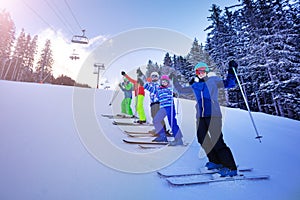 Group ski sports kids portrait on mountain slope