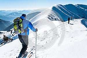 Group skialpinists snow covered mountains