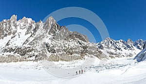 A group of skiers look at Leschaux Glacier, in the Mont Blanc massif, the highest mountain in Europe.