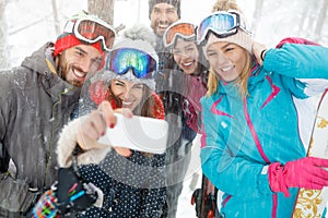 Group of skiers making photo