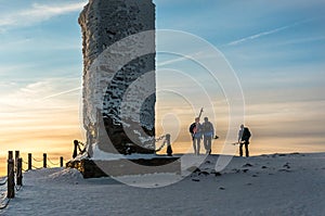 Group of skiers on the mountain top Snezka