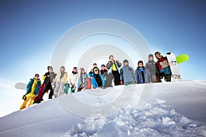 Group of skiers and snowboarders photo