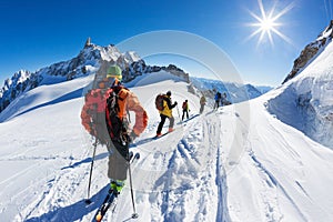 A group of skiers start the descent of VallÃ©e Blanche, Mont Blanc Massif. Chamonix, France, Europe.