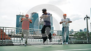 Group of skilled break dancer perform hip hop foot step together. Sprightly.