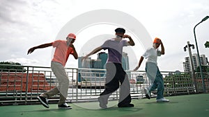 Group of skilled break dancer perform hip hop foot step together. Sprightly.